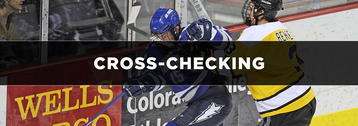 What Is Cross-Checking In Hockey? [2023 Updated Rule]